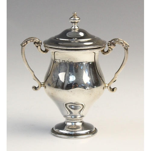 103 - A George V twin-handled silver trophy cup by F C Richards, Birmingham 1940, of typical form with kno... 