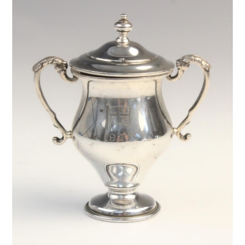 103 - A George V twin-handled silver trophy cup by F C Richards, Birmingham 1940, of typical form with kno... 