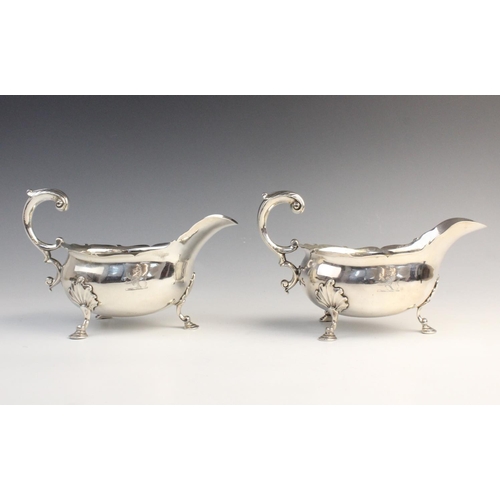 104 - A pair of George II silver sauce boats by William Grundy, London 1755, each of classic form with sha... 