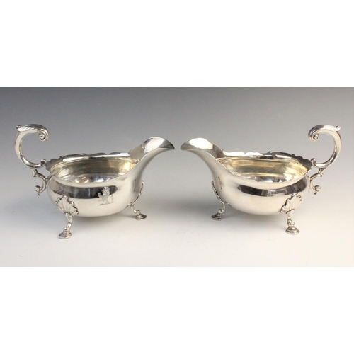 104 - A pair of George II silver sauce boats by William Grundy, London 1755, each of classic form with sha... 