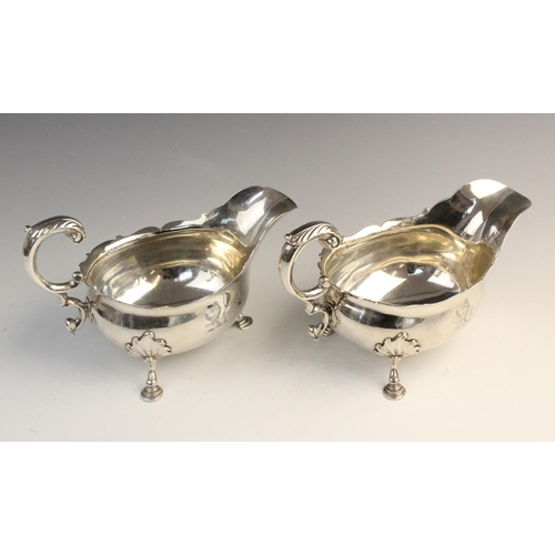 104 - A pair of George II silver sauce boats by William Grundy, London 1755, each of classic form with sha... 