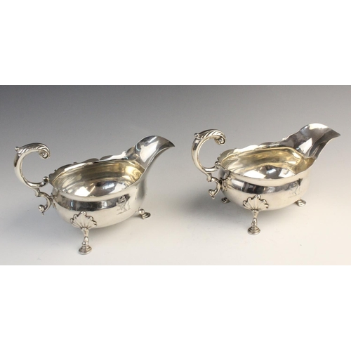 104 - A pair of George II silver sauce boats by William Grundy, London 1755, each of classic form with sha... 