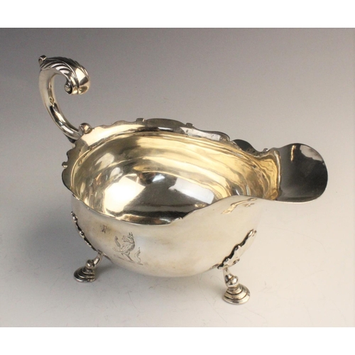 104 - A pair of George II silver sauce boats by William Grundy, London 1755, each of classic form with sha... 