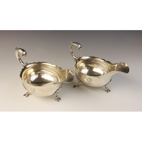 104 - A pair of George II silver sauce boats by William Grundy, London 1755, each of classic form with sha... 