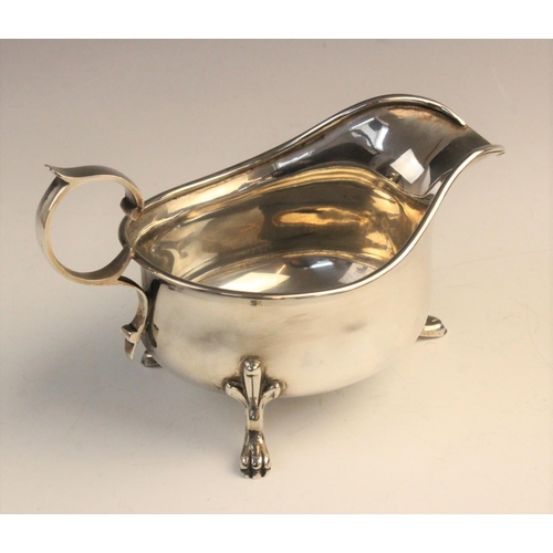 107 - A pair of George V silver sauceboats by M Beaver Ltd, Sheffield 1936, each of typical form with scro... 