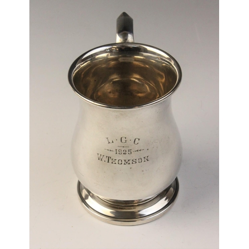 109 - A George V silver bell-shaped mug, marked for ‘MB Ltd’ London 1923, plain polished on stepped circul... 