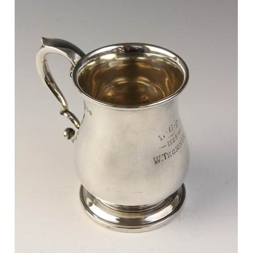 109 - A George V silver bell-shaped mug, marked for ‘MB Ltd’ London 1923, plain polished on stepped circul... 