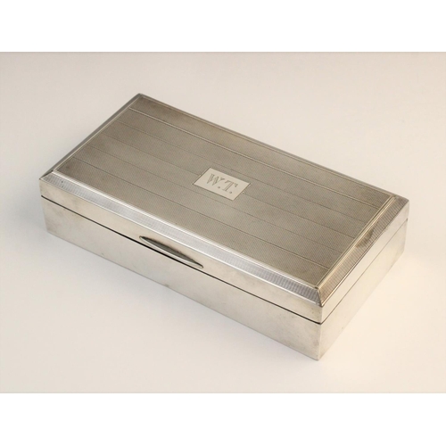 110 - A George V silver cigarette box by John Rose, Birmingham 1946, of rectangular form with engine turne... 