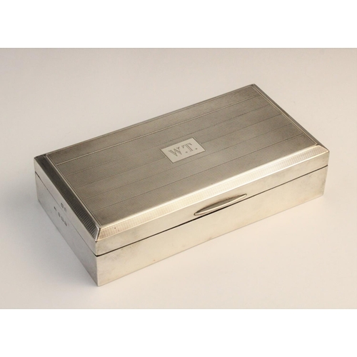 110 - A George V silver cigarette box by John Rose, Birmingham 1946, of rectangular form with engine turne... 