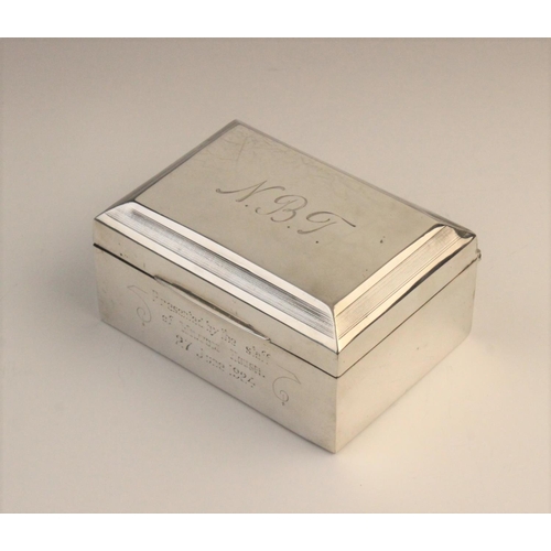 111 - A George V silver cigarette box by F H Adams & Co, Birmingham 1922, of rectangular form with engine ... 