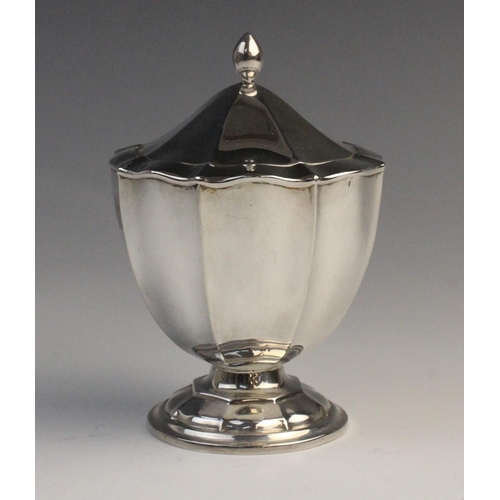 112 - An Edwardian silver sauce boat by Horace Woodward & Co Ltd, London 1910, of faceted form with scroll... 