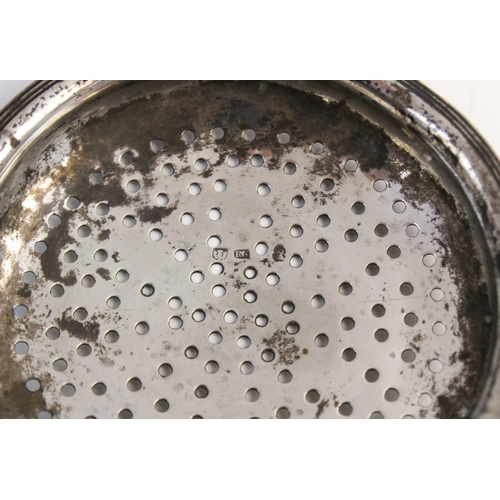 114 - A George III Scottish silver lemon strainer, (maker’s marks and date marks worn) of typical form wit... 