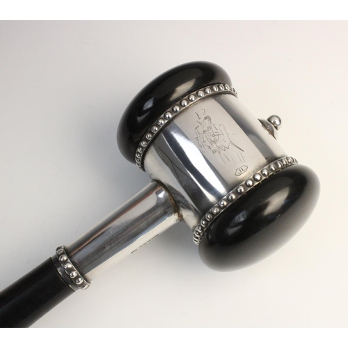 119 - A mid-twentieth century ebonised presentation gavel, plain polished with white metal mounts and bead... 