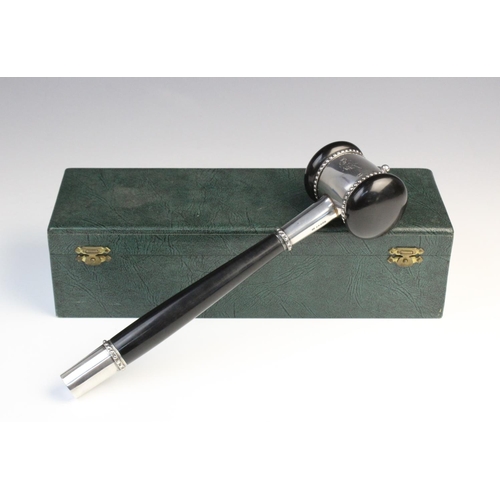 119 - A mid-twentieth century ebonised presentation gavel, plain polished with white metal mounts and bead... 