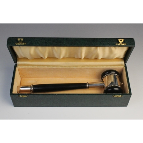 119 - A mid-twentieth century ebonised presentation gavel, plain polished with white metal mounts and bead... 