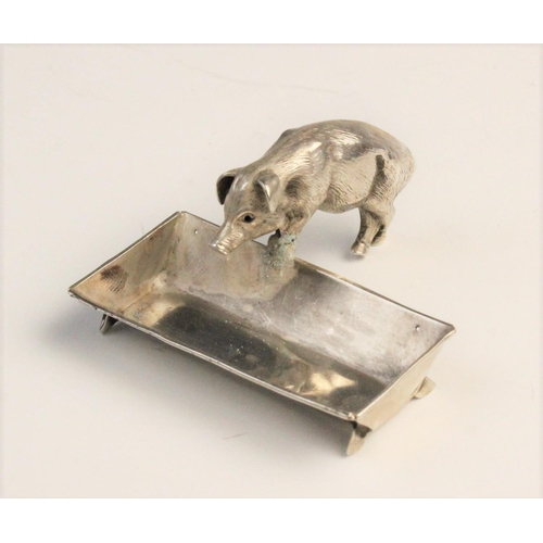 125 - A novelty silver open salt, Chester circa 1900, realistically modelled as a pig and trough, the trou... 