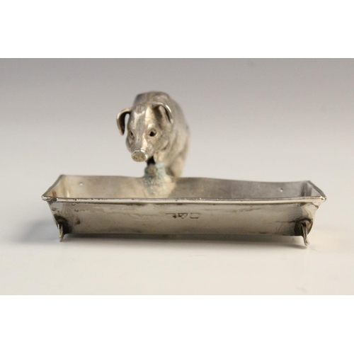 125 - A novelty silver open salt, Chester circa 1900, realistically modelled as a pig and trough, the trou... 