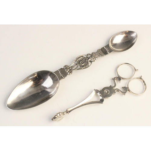 126 - A pair of eighteenth century silver sugar nips, circa 1750, 12.6cm long, together with a folding dou... 