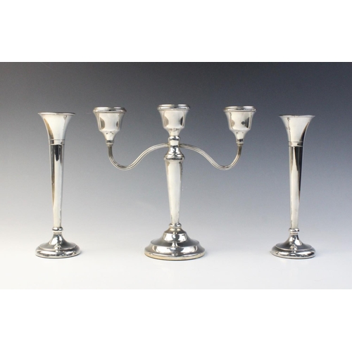 13 - A three-branch silver candelabra by Mappin & Webb, Birmingham 1973, (weighted) 22.8cm high, together... 