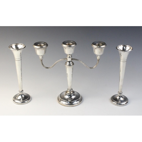 13 - A three-branch silver candelabra by Mappin & Webb, Birmingham 1973, (weighted) 22.8cm high, together... 