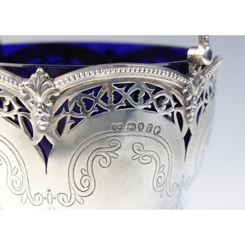 17 - A Victorian silver swing-handled sugar basket by Henry Wilkinson & Co, London 1872, the tapering bow... 
