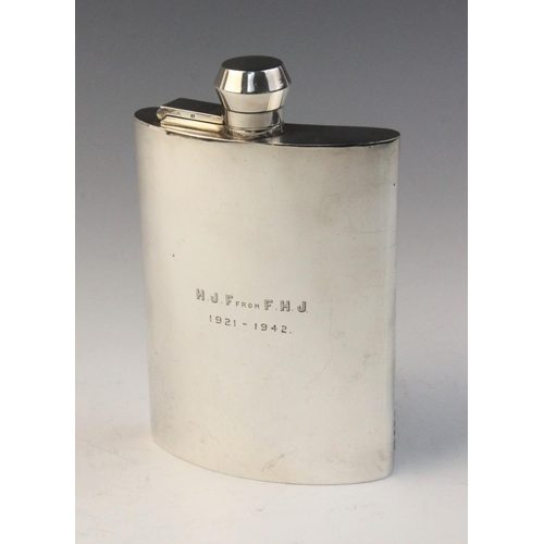 29 - A George V silver hip flask by F Burton Crosbee, Birmingham 1942, of curved rectangular form with ba... 