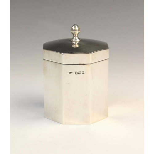 3 - A George V silver tea caddy by Walker & Hall, Sheffield 1922, of octagonal form with hinged cover an... 