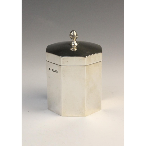 3 - A George V silver tea caddy by Walker & Hall, Sheffield 1922, of octagonal form with hinged cover an... 