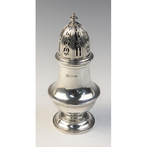 30 - A George V silver sugar caster by Elkington & Co, Birmingham 1928, of  baluster form with reeded bor... 