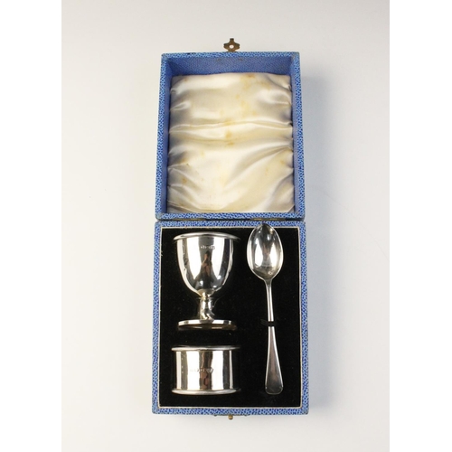 38 - A boxed silver Christening set by Adie Brothers, Birmingham 1938, comprising egg cup, spoon and napk... 