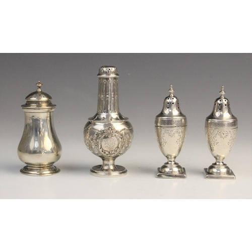 56 - A pair of Victorian silver pepperettes by John Aldwinckle & Thomas Slater, London 1888, each of urn ... 