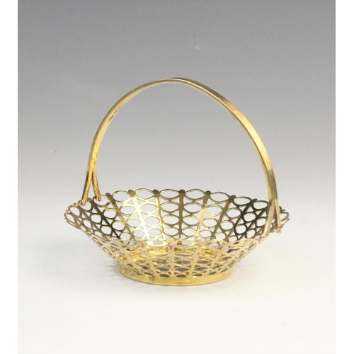 57 - A silver gilt bon-bon basket by Adie Brothers Ltd, Birmingham 1958, of tapered circular form with pi... 