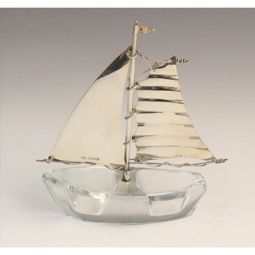 58 - A novelty silver and glass salt in the form of a sailing boat, import marks for Israel Freeman & Son... 