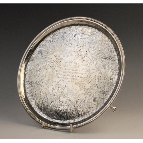 69 - A Victorian silver salver by James Dixon & Sons, Sheffield 1877, of circular form on three paw feet,... 