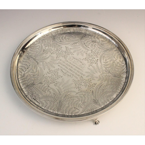 69 - A Victorian silver salver by James Dixon & Sons, Sheffield 1877, of circular form on three paw feet,... 