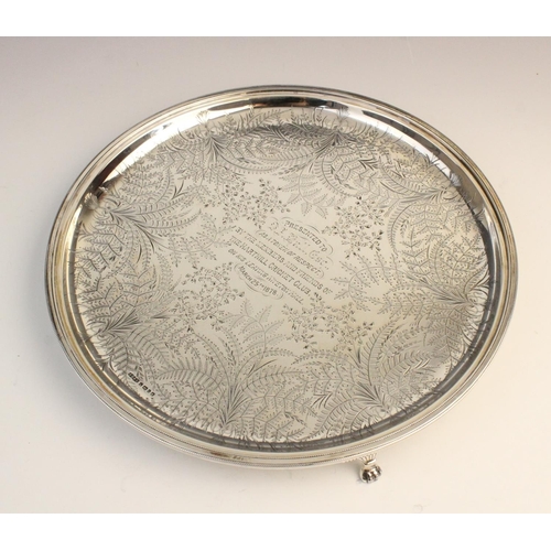 69 - A Victorian silver salver by James Dixon & Sons, Sheffield 1877, of circular form on three paw feet,... 