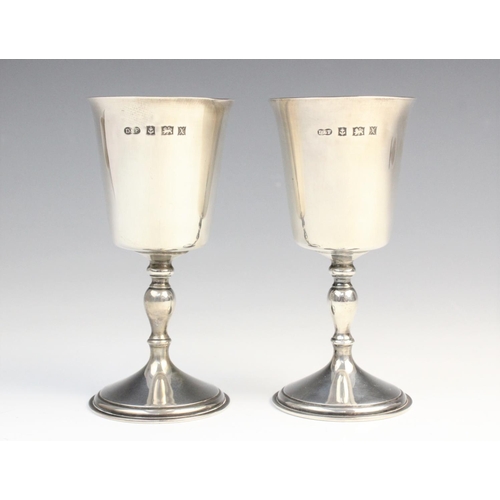 73 - A pair of silver goblets by Deakin & Francis, Birmingham 1972, each of tapered form with gilt interi... 