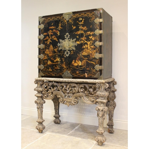 742 - A Chinoiserie lacquered cabinet on stand, 17th/18th century, the painted European wood and gesso Roc... 