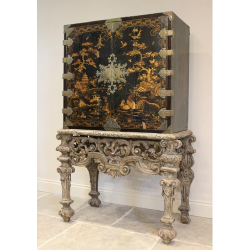 742 - A Chinoiserie lacquered cabinet on stand, 17th/18th century, the painted European wood and gesso Roc... 