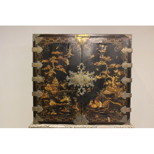 742 - A Chinoiserie lacquered cabinet on stand, 17th/18th century, the painted European wood and gesso Roc... 