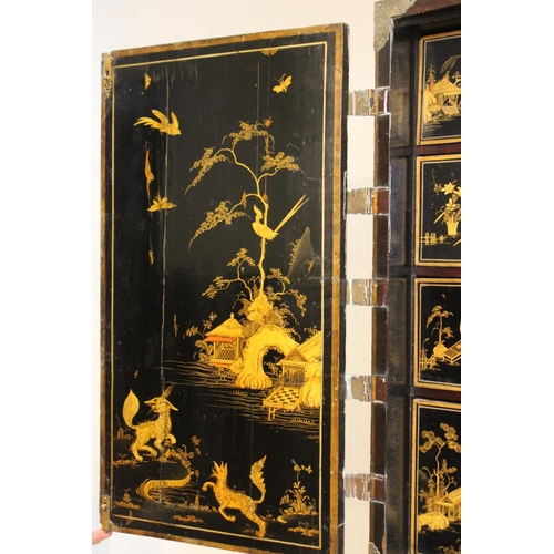 742 - A Chinoiserie lacquered cabinet on stand, 17th/18th century, the painted European wood and gesso Roc... 