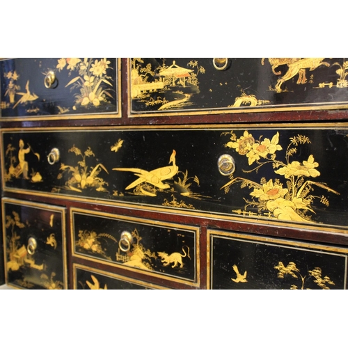 742 - A Chinoiserie lacquered cabinet on stand, 17th/18th century, the painted European wood and gesso Roc... 