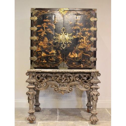 742 - A Chinoiserie lacquered cabinet on stand, 17th/18th century, the painted European wood and gesso Roc... 