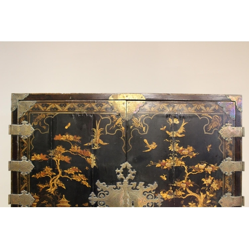 742 - A Chinoiserie lacquered cabinet on stand, 17th/18th century, the painted European wood and gesso Roc... 