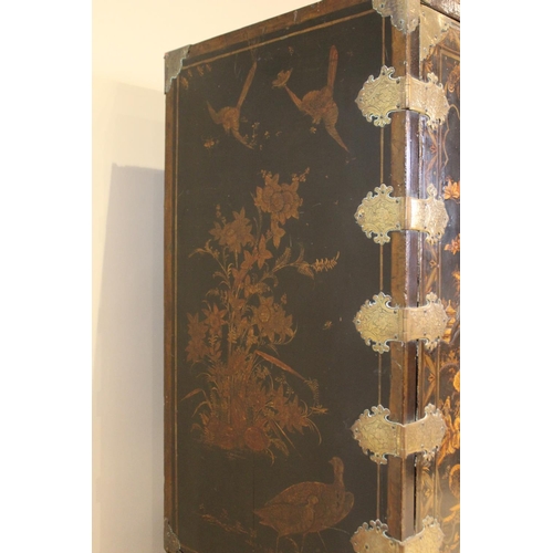 742 - A Chinoiserie lacquered cabinet on stand, 17th/18th century, the painted European wood and gesso Roc... 