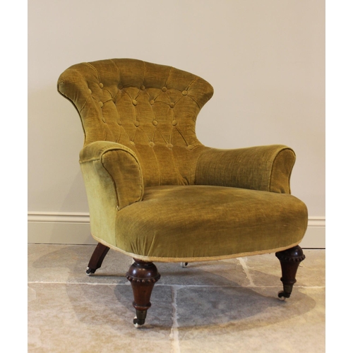 748 - A Victorian walnut and upholstered tub chair, the fan shaped button back above a bow front sprung se... 