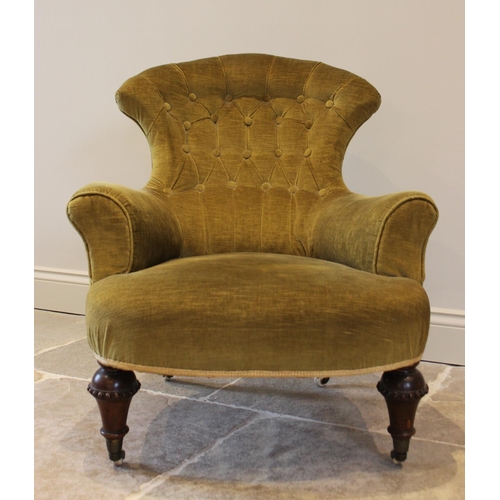 748 - A Victorian walnut and upholstered tub chair, the fan shaped button back above a bow front sprung se... 