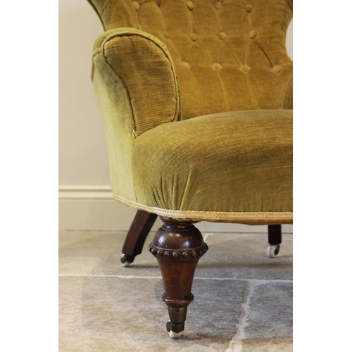 748 - A Victorian walnut and upholstered tub chair, the fan shaped button back above a bow front sprung se... 