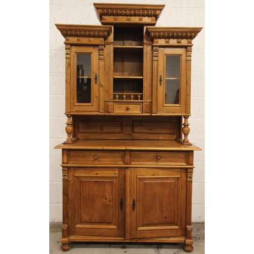 751 - A Victorian style pine kitchen dresser, late 20th century, the turreted high back with central open ... 