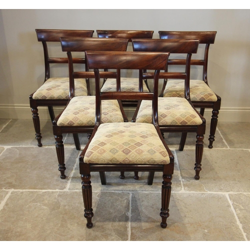 752 - A set of six William IV mahogany dining chairs, each with a concave rail back above an upholstered d... 